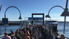 Afternoon commuters of both the King County Water Taxi and Kitsap Transit Fast Ferry crowd Pier 50 in Downtown Seattle.
