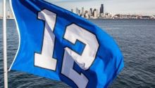 A Seahawks' 12th Man flag flies aboard the King County Water Taxi.