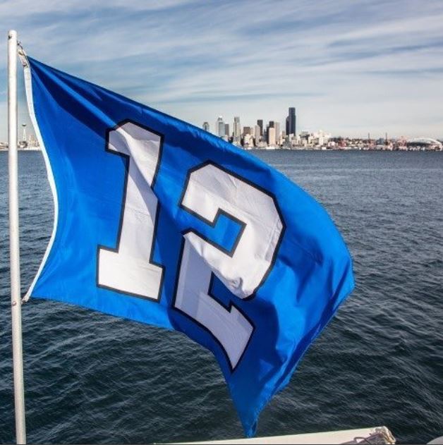 A Seahawks' 12th Man flag flies aboard the King County Water Taxi.