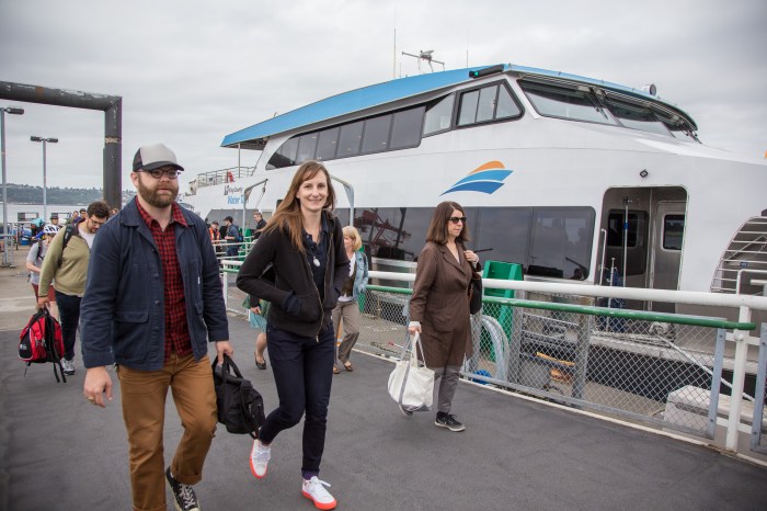 Riders from Vashon Island disembark the MV Sally Fox in Seattle.