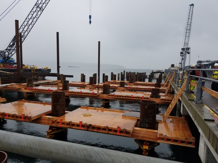 Crews install falsework at the future site of King County Water Taxi Passenger Only Ferry (POF) facility on the Seattle waterfront.