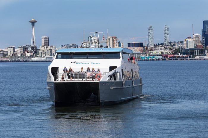 With Seattle's famed Space Needle in the background, the MV Doc Maynard glides across Elliott Bay toward West Seattle.