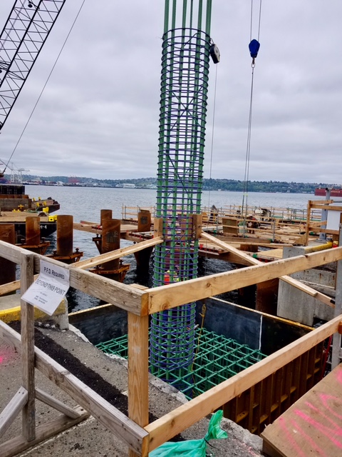 Crews work near the future King County Water Taxi passenger ferry terminal in Seattle