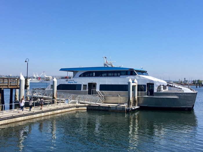 Riders make their way toward the MV Doc Maynard in West Seattle.