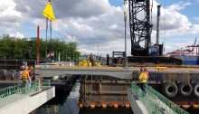 Crews install the first deck slabs of King County Water Taxi's future Passenger Only Ferry (POF) facility in July 2018.