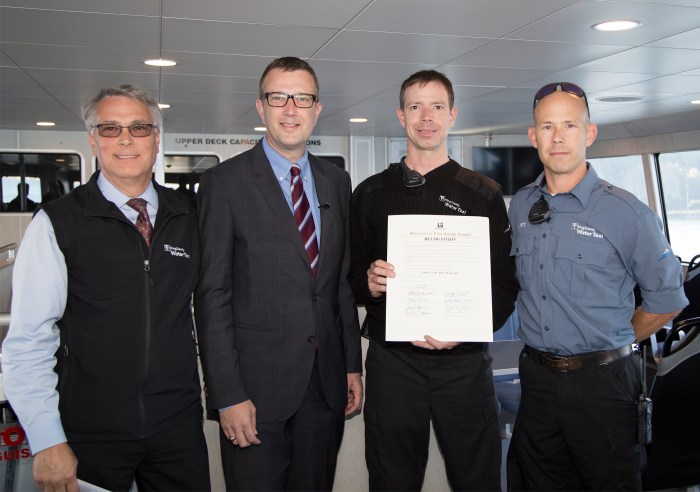 Councilmember Joe McDermott with Marine Division Director Paul Brodeur, Jeff Bearden, Captain of the Water Taxi Doc Maynard and Deckhand Bob McDougall. The County Council recognized Captain Bearden and his crew for rescuing a man who fell out of his boat into Elliott Bay near West Seattle’s Seacrest Dock.