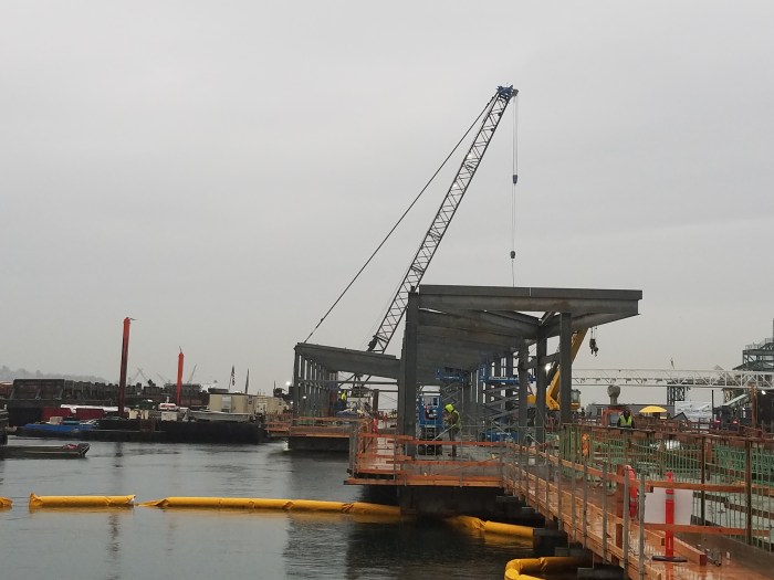 A westward-facing image at King County Water Taxi's future Passenger Only Ferry (POF) facility. With completion of the shelter's structural frame - show being built in this picture - it marks the first time work on the facility has gone vertical.