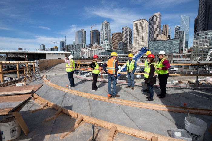 Standing on the view deck, with downtown Seattle in the background.
