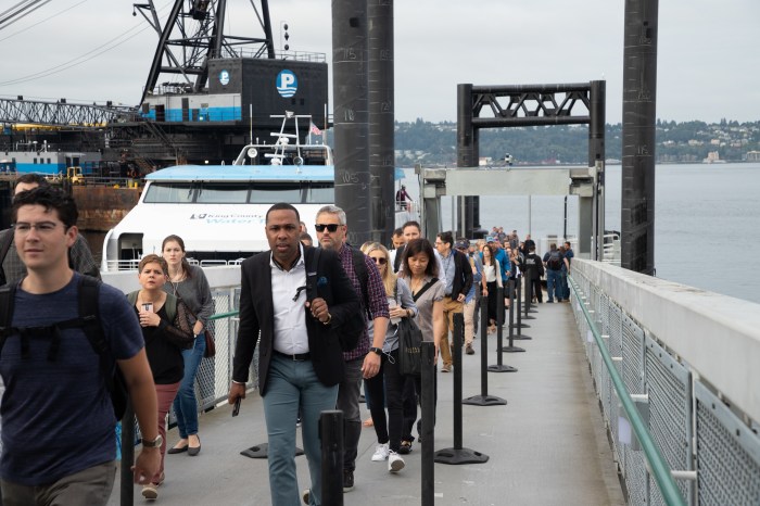 Passengers walking up the gangway into the new facility