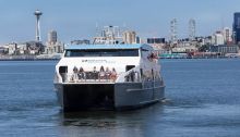 Water Taxi heading to West Seattle with Seattle Skyline in background