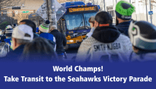 Bus and Seahawks fan crowd. Text is World Champs! Take transit to the Seahawks victory parade.