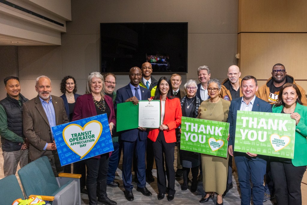 King County Executive Girmay Zahilay, alongside County Council members and Metro leadership, after the reading of the read a proclamation declaring the week of March 22-28 Transit Appreciation Week in King County